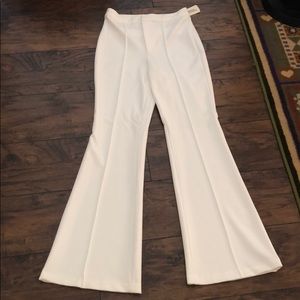 White flared high waisted trousers
